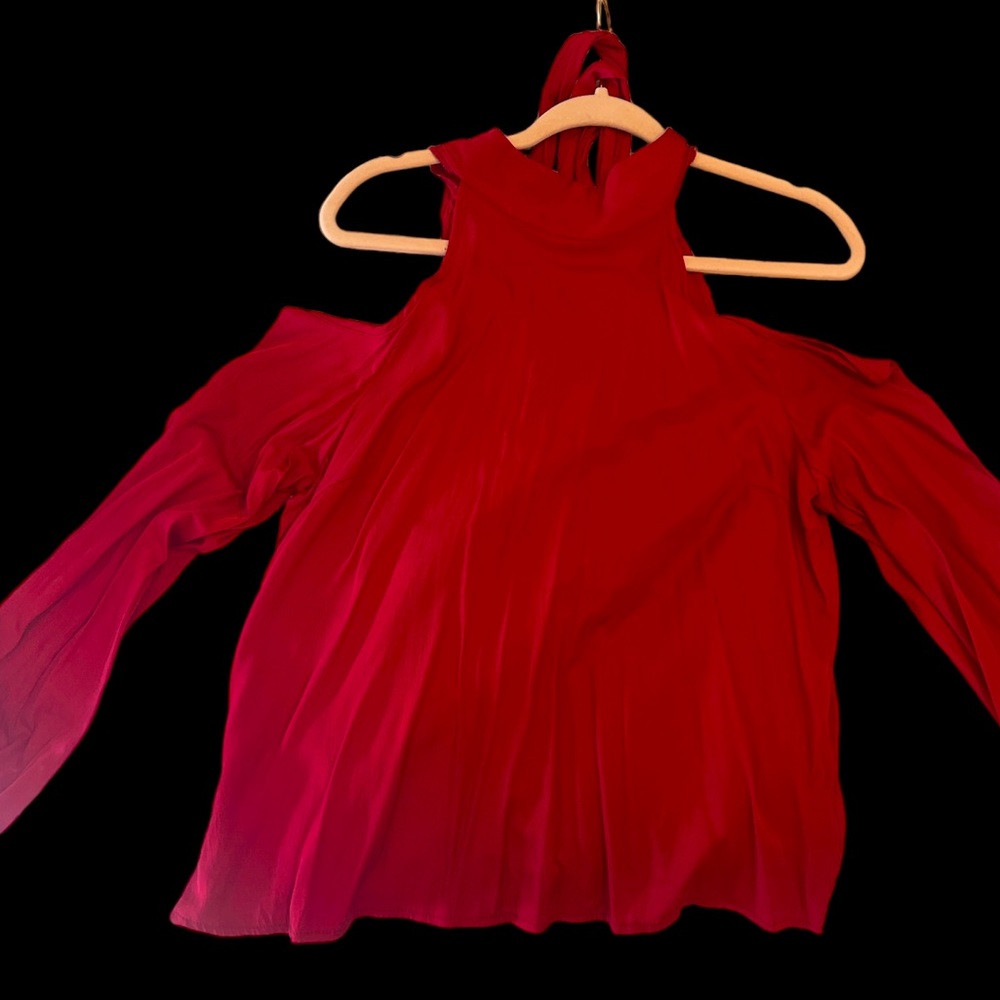 Red high neck with tie down the back with long sleeves and open shoulders